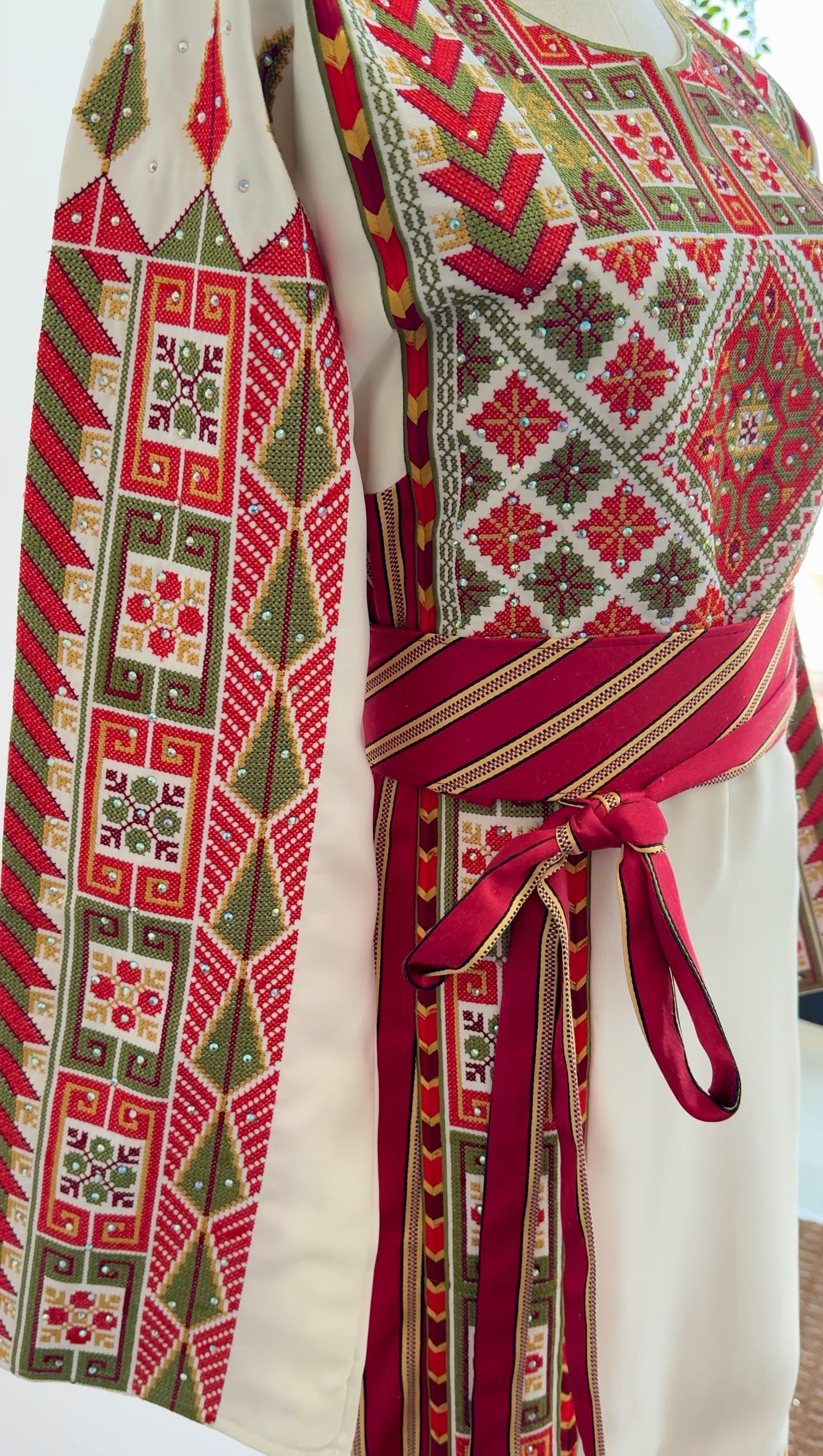 Full-length image showcasing the flowing silhouette and sash belt detail