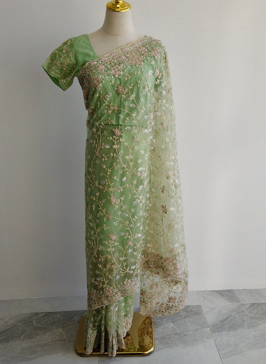 Pastel green net saree with floral embroidery – Arisca Qatar