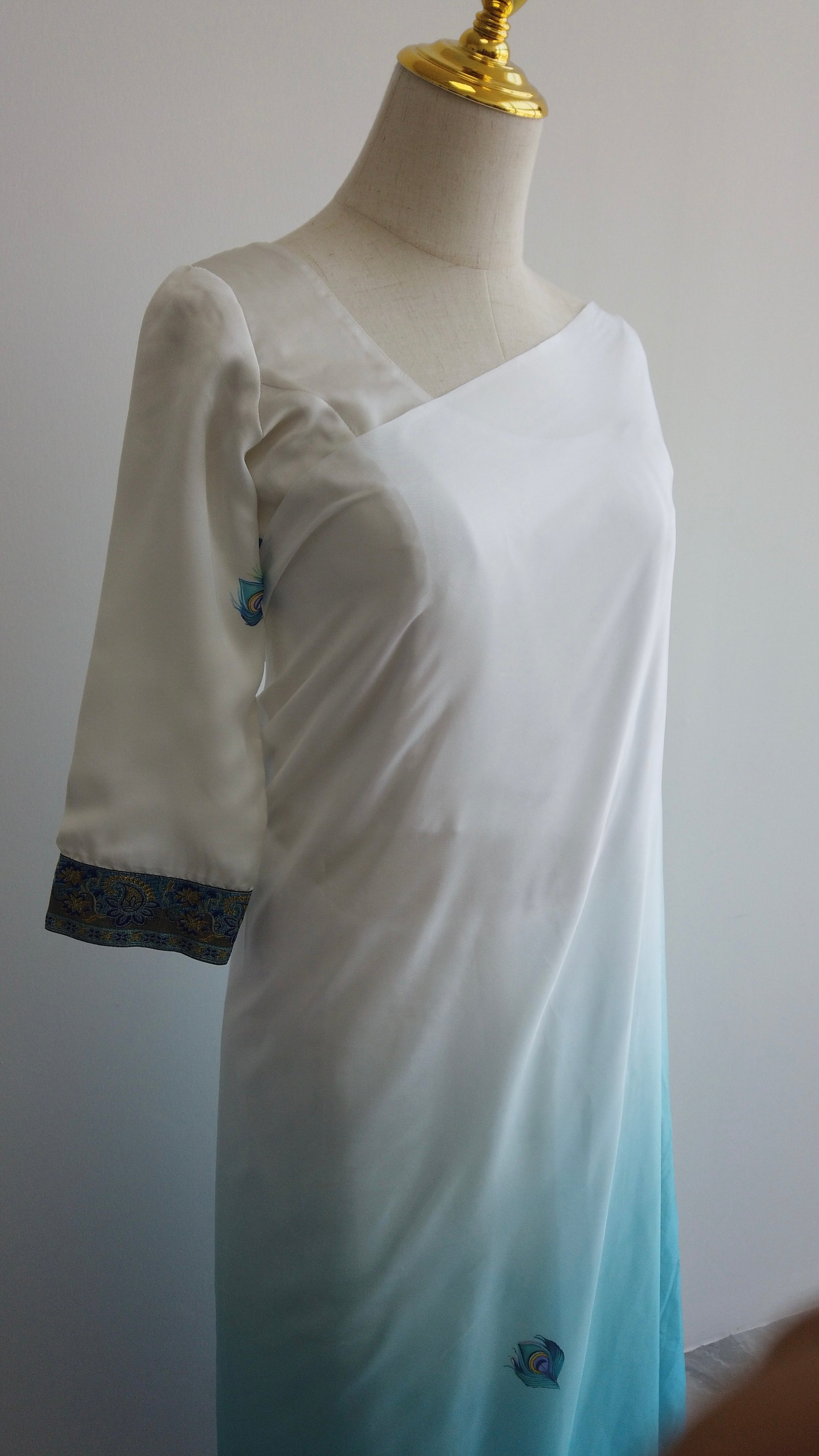 Full-length view of kaftan saree showing flowing sleeves and relaxed silhouette.