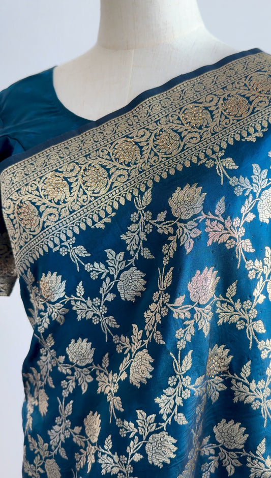 Royal blue Banarasi silk ready-to-wear saree with gold zari motifs displayed on a mannequin, showing full drape and border