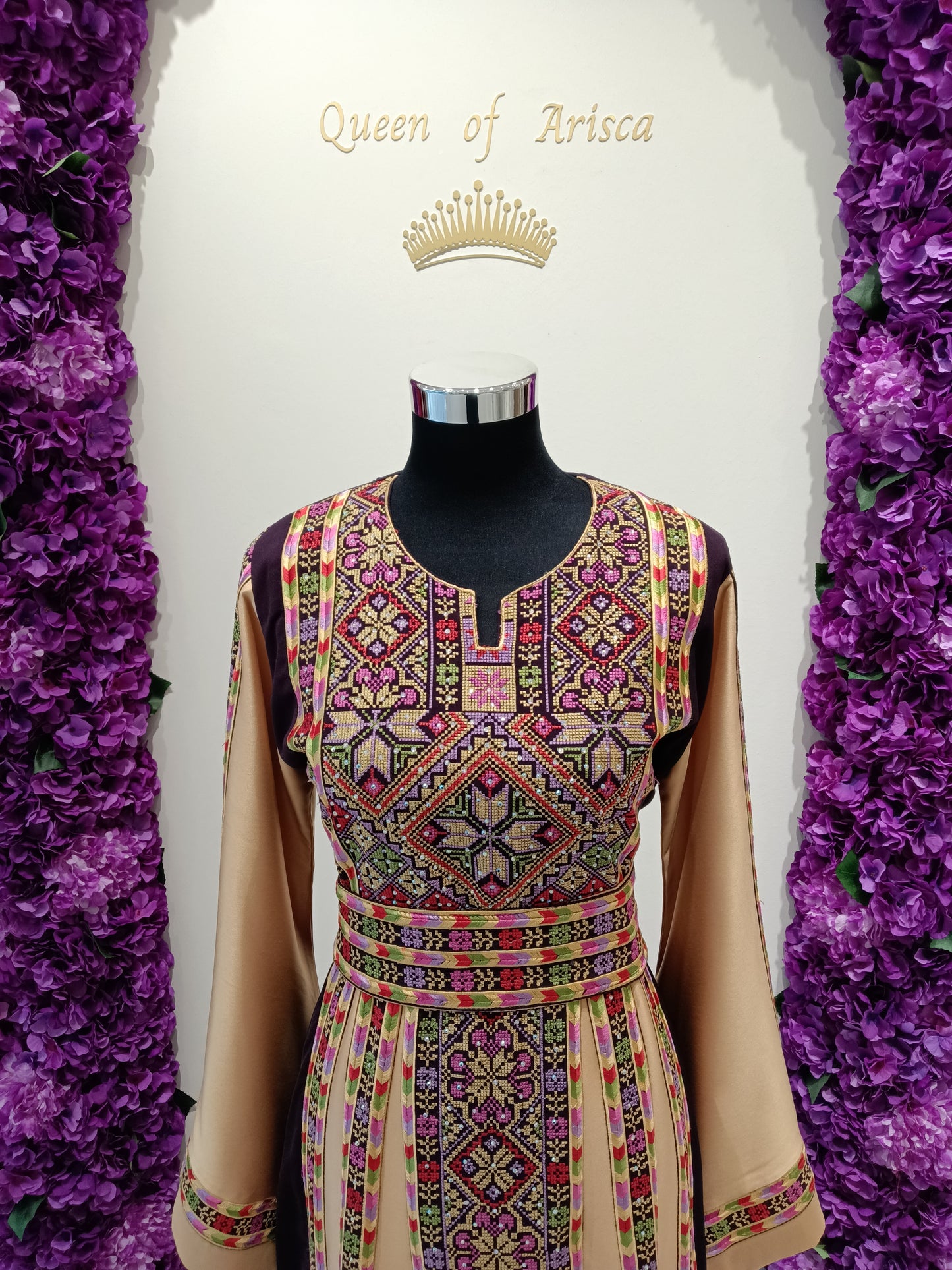 elegant Palestinian thobe is crafted from a premium satin-blend fabric with a soft, luxurious sheen and fluid drape.