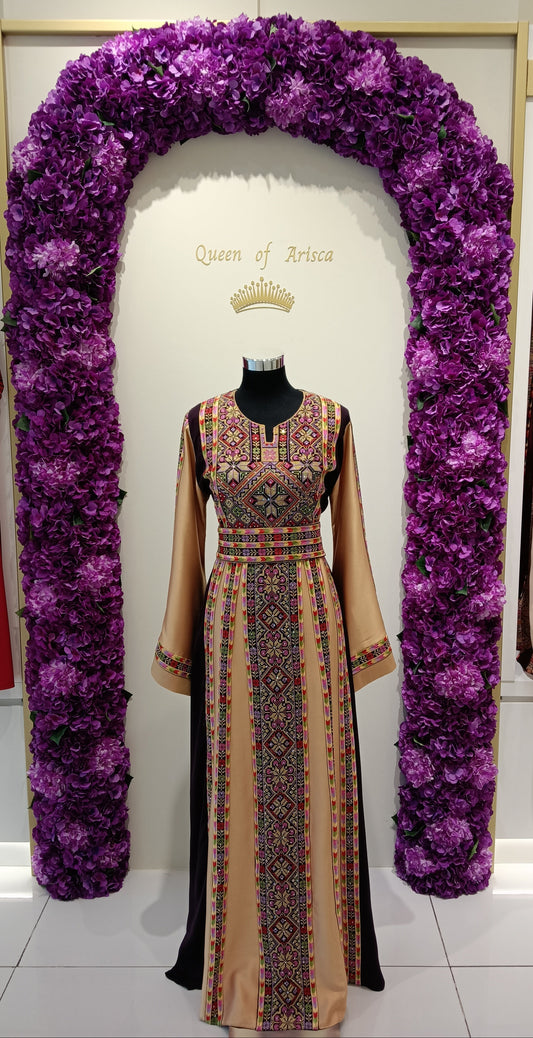 elegant Palestinian thobe in Qatar. Burgundy and champagne with floral embroidery