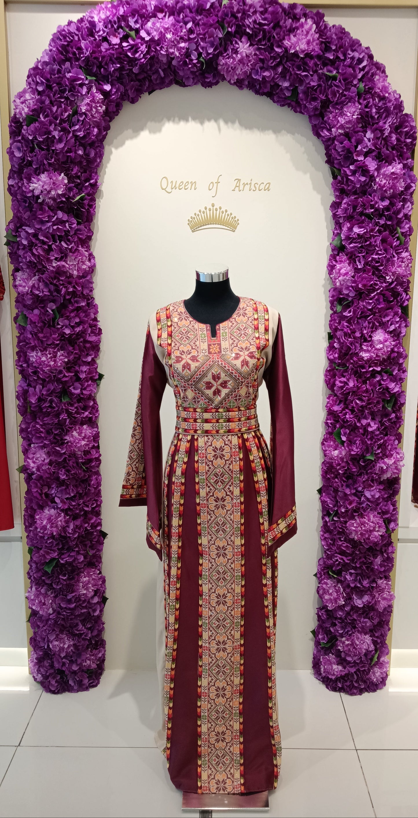 maroon Palestinian embroidered thobe in Qatar. Elegant, cultural dress for weddings, Eid & special events.