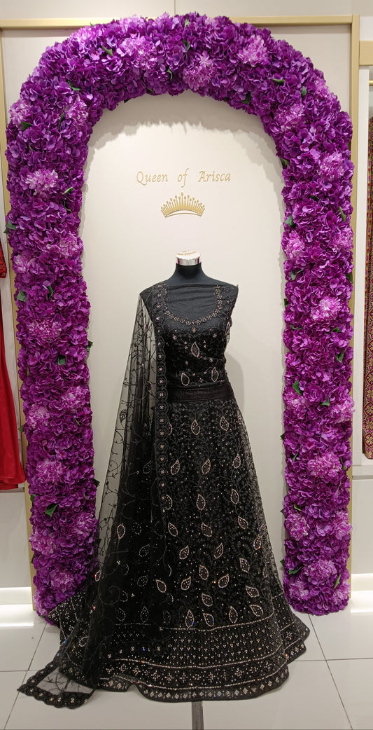 Lehenga Skirt: Premium embroidered net with silver stone and sequin work , Blouse: Net blouse with neckline detailing.