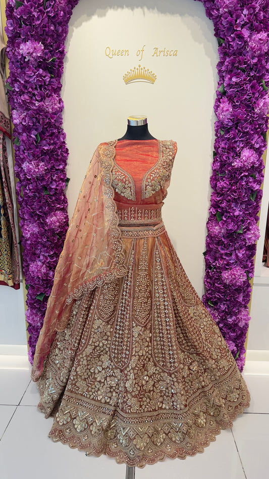 Luxury Orange embroidered lehenga in Qatar by Arisca