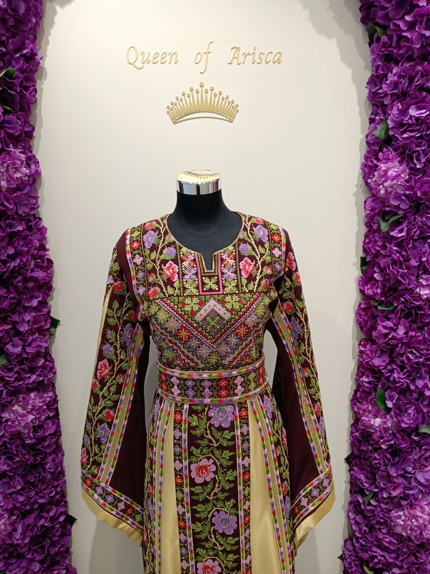 elegant Palestinian thobe is crafted from a premium satin-blend fabric with a soft, luxurious sheen and graceful flow.
