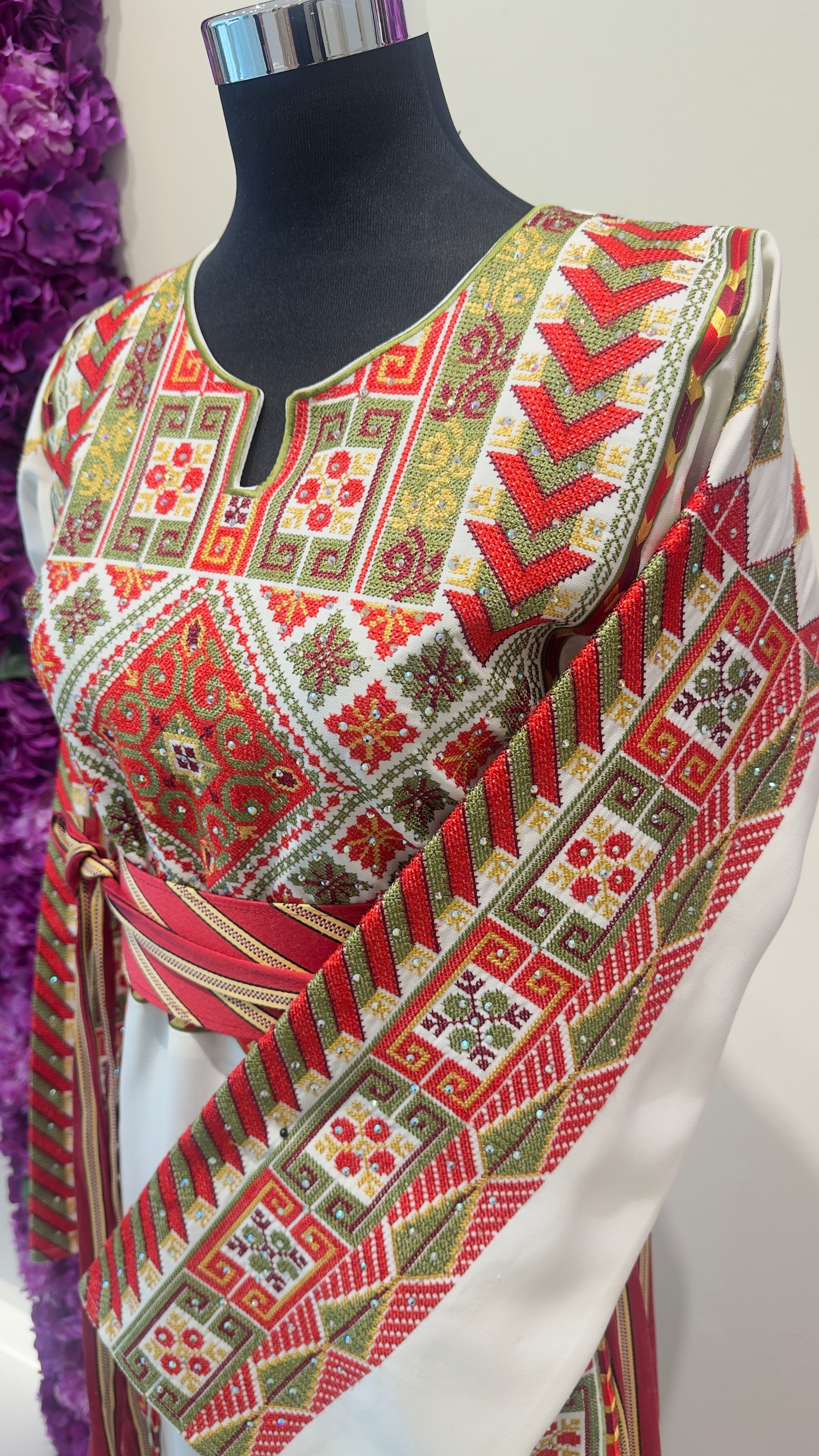 Traditional patterned fabric on a mannequin with a white background