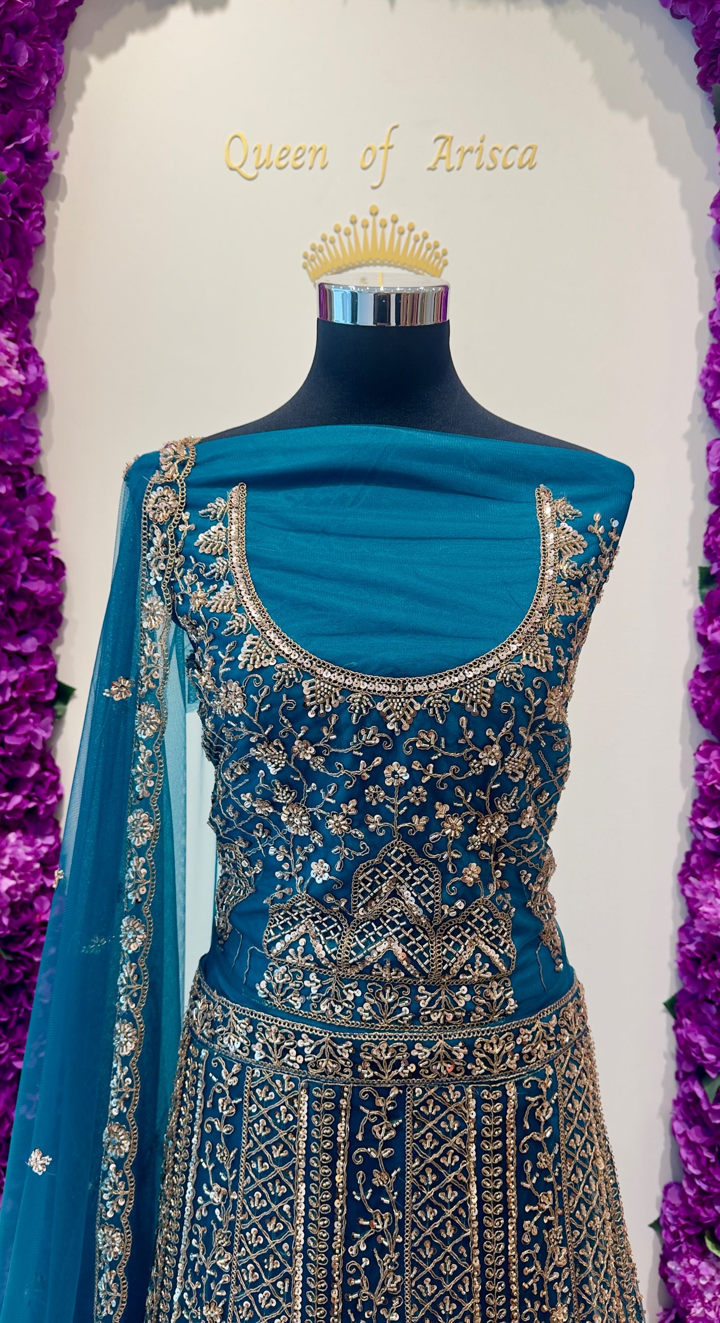 luxury peacock teal heavy bridal lehenga in Qatar. Dense antique gold zari work on premium net, perfect for receptions and weddings in Doha 