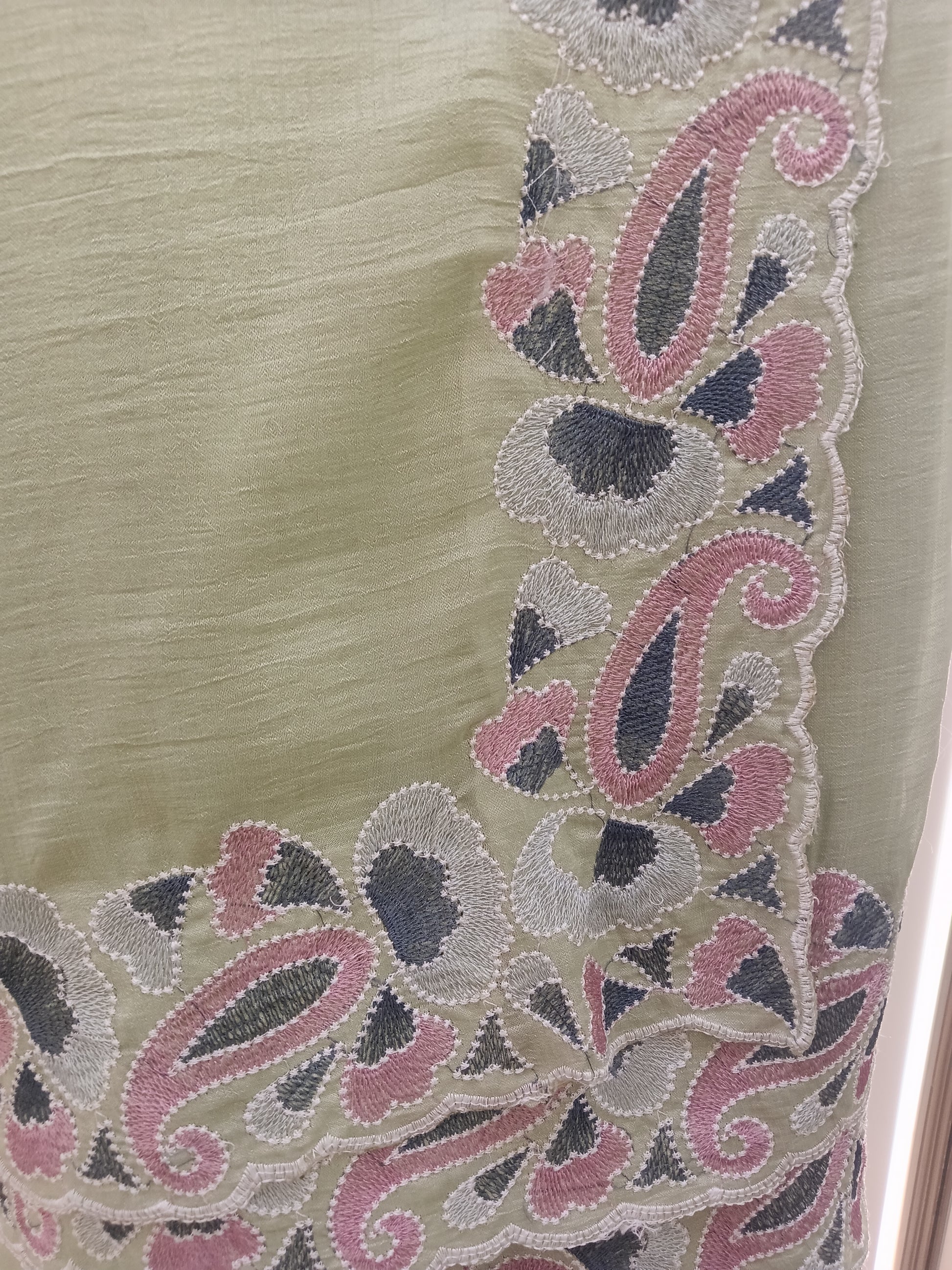Saree with beautifully embroidered border in blush pink, silver-grey, and ivory threadwork, adding a soft feminine finish