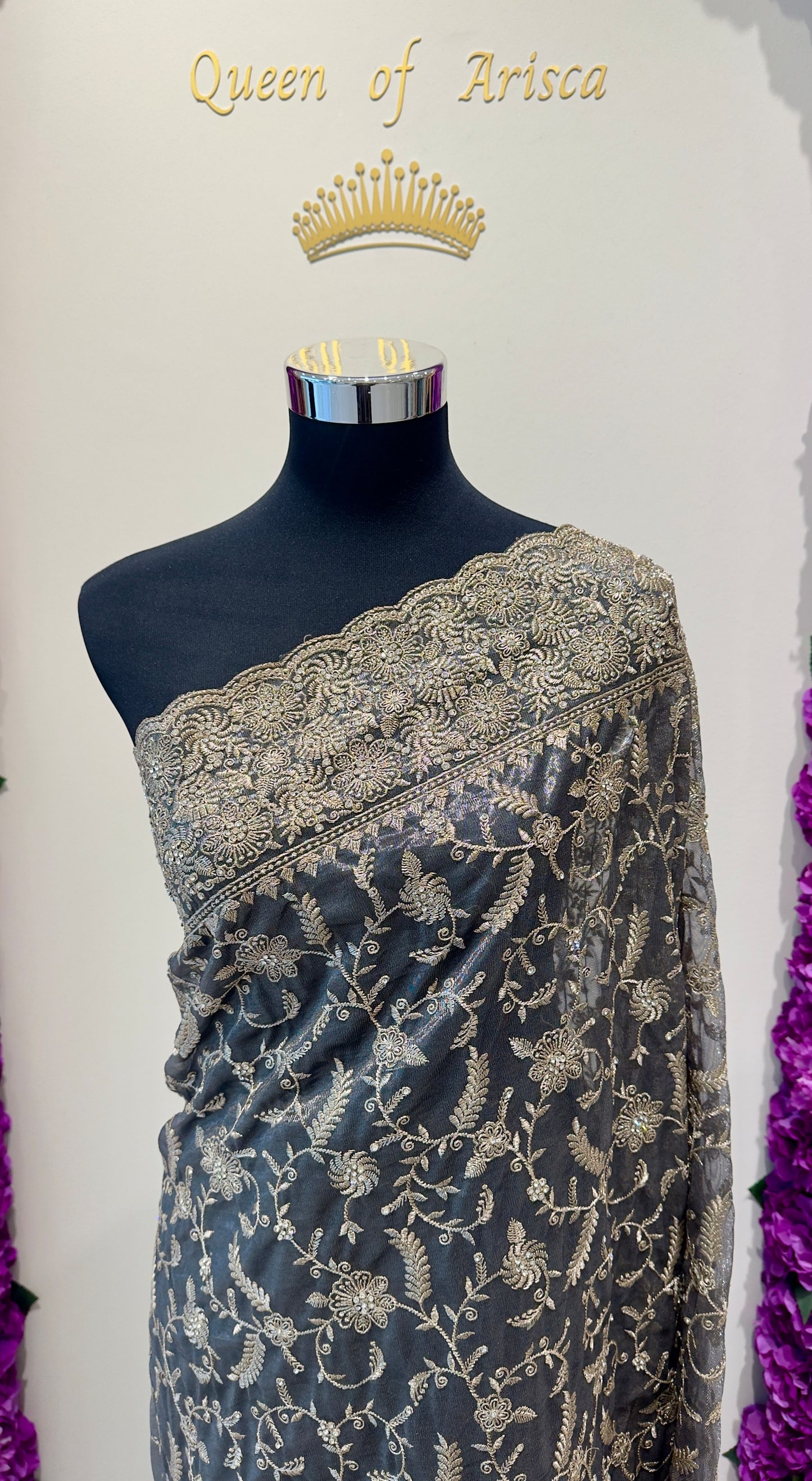 Saree - rich steel grey / smoky charcoal base with elegant gold embellishments, creating a timeless and sophisticated look.
