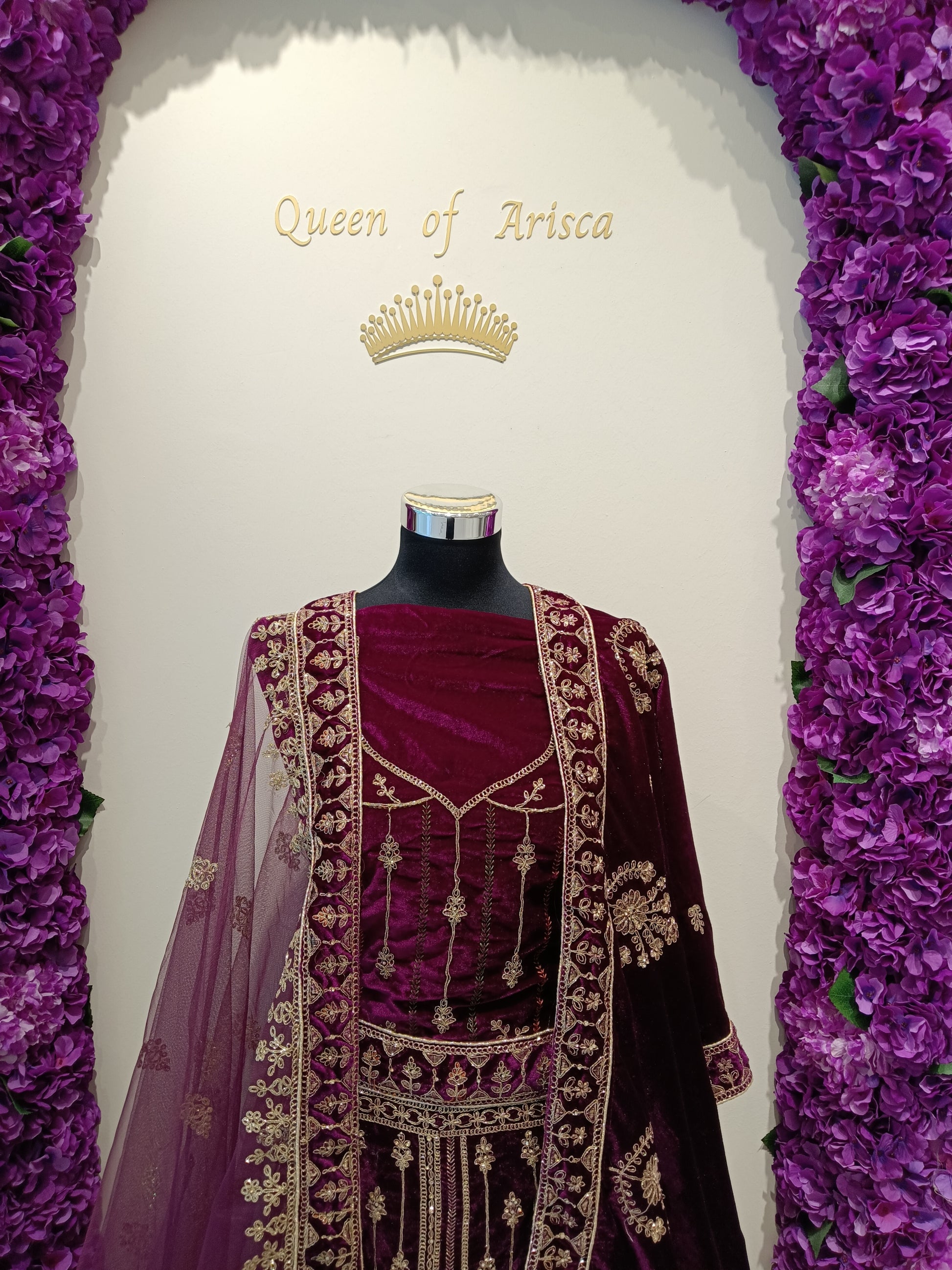 Maroon Premium velvet lehenga with dense zari, stone, and thread work.