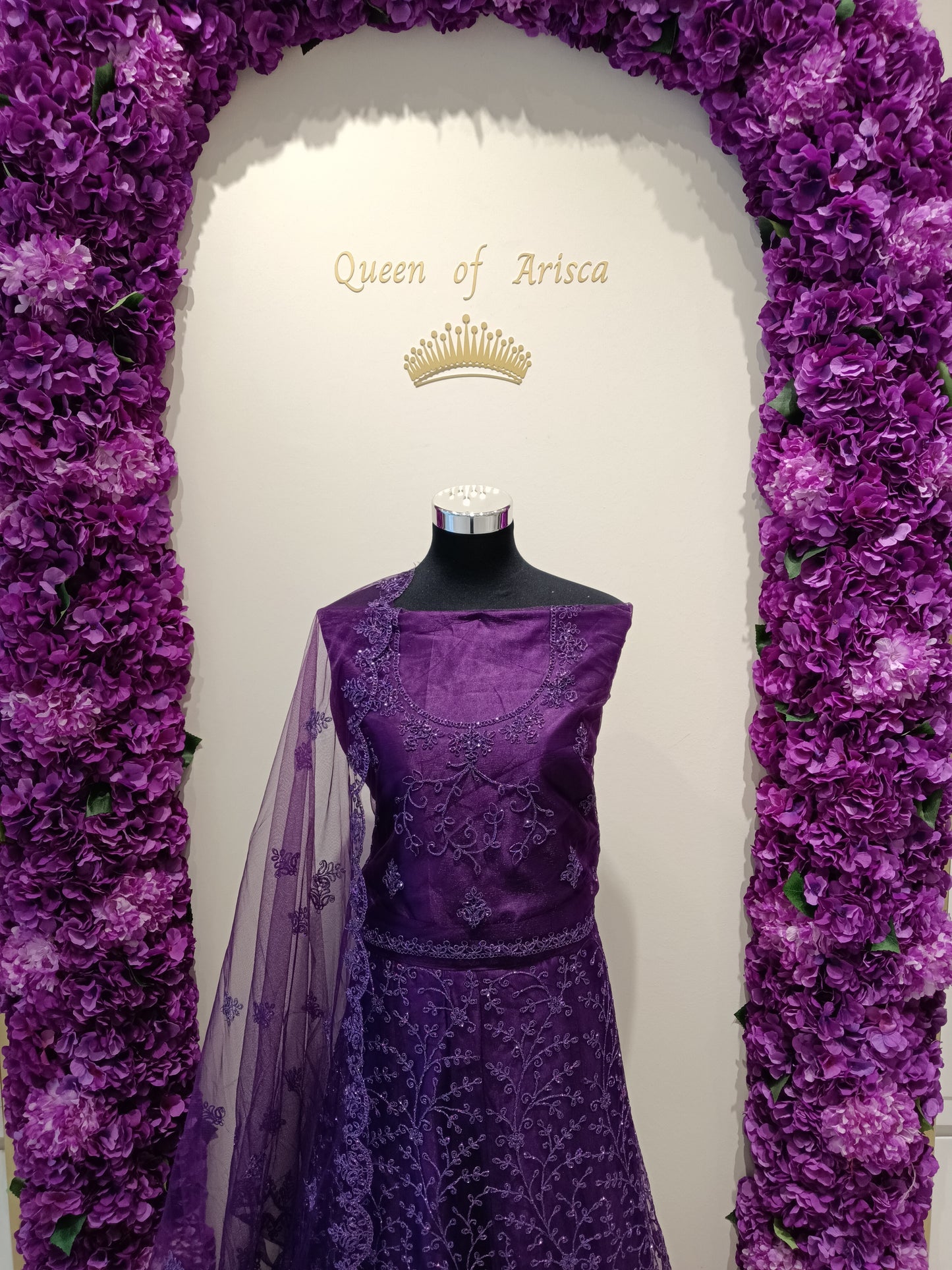 Blouse: Matching purple net with embroidered neckline , Dupatta: Sheer purple net with butti and border detailing. 