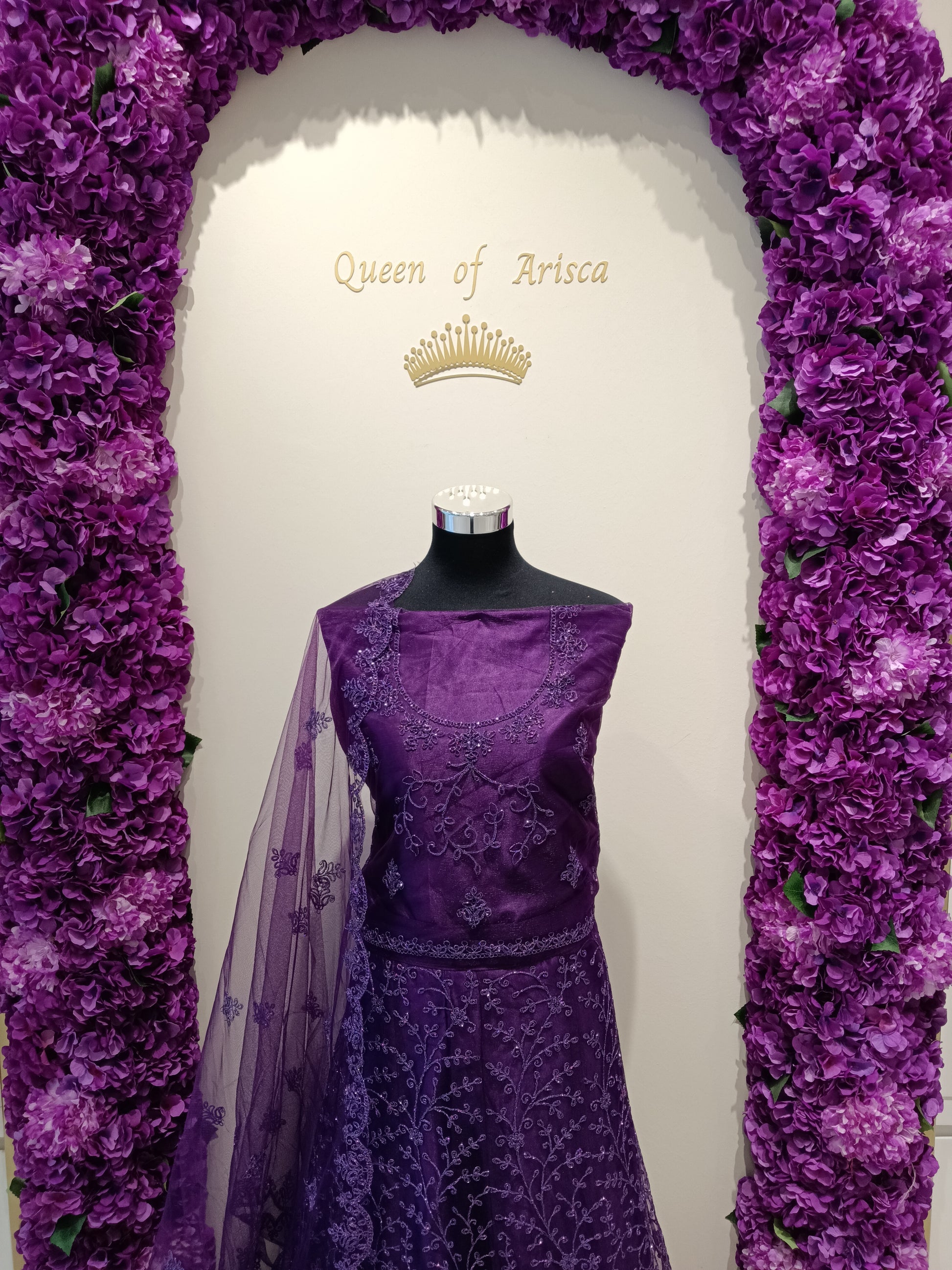 Blouse: Matching purple net with embroidered neckline , Dupatta: Sheer purple net with butti and border detailing. 