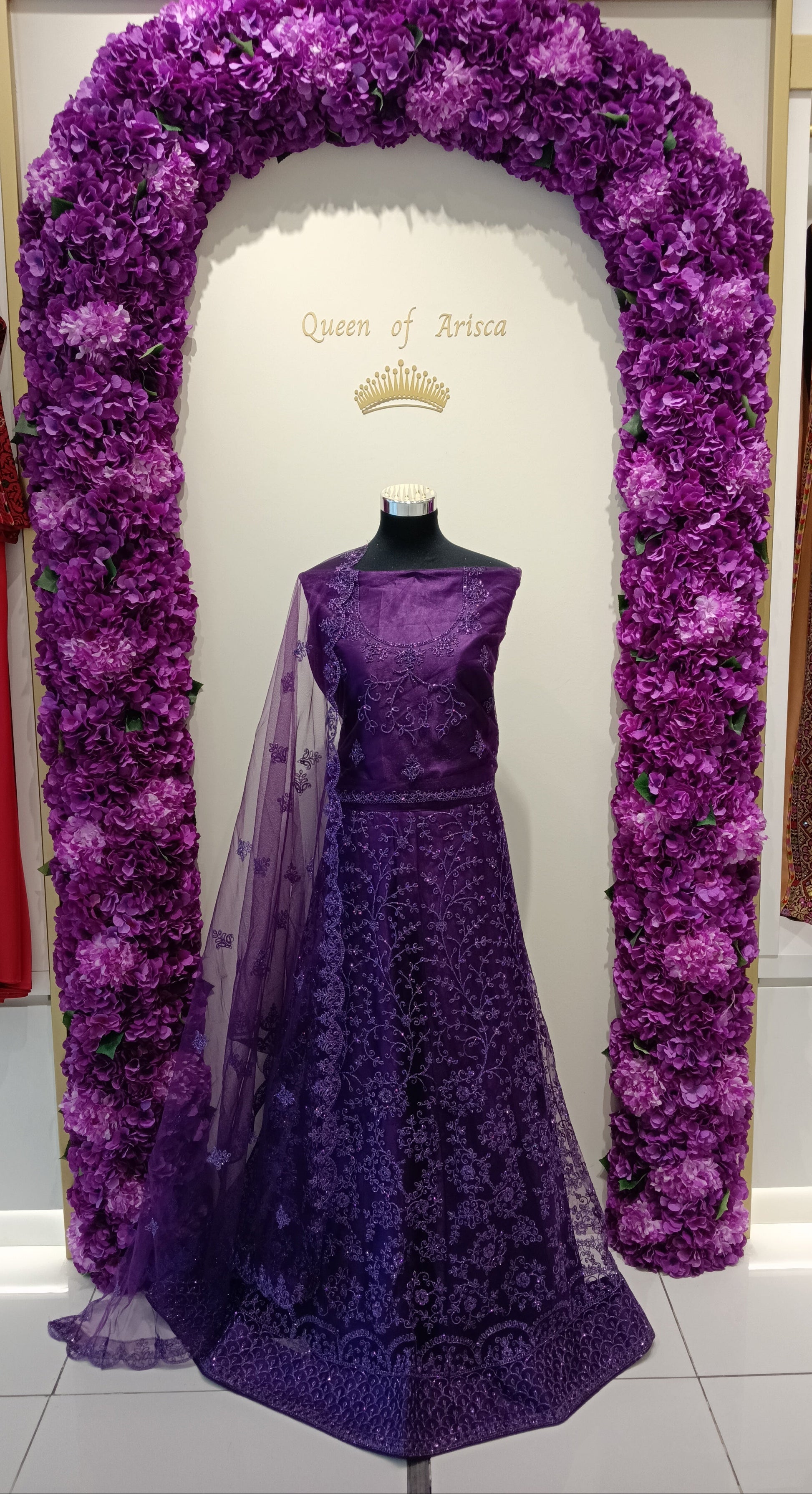deep royal purple lehenga features delicate tonal embroidery with a floral pattern.