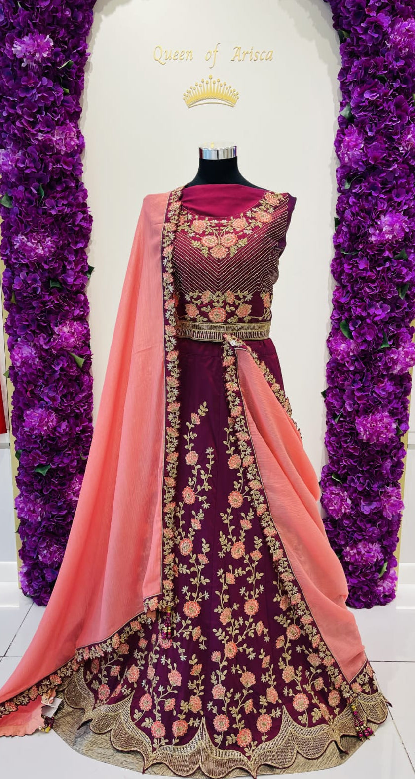 A deep purple and pink embroidered traditional party wear lehenga