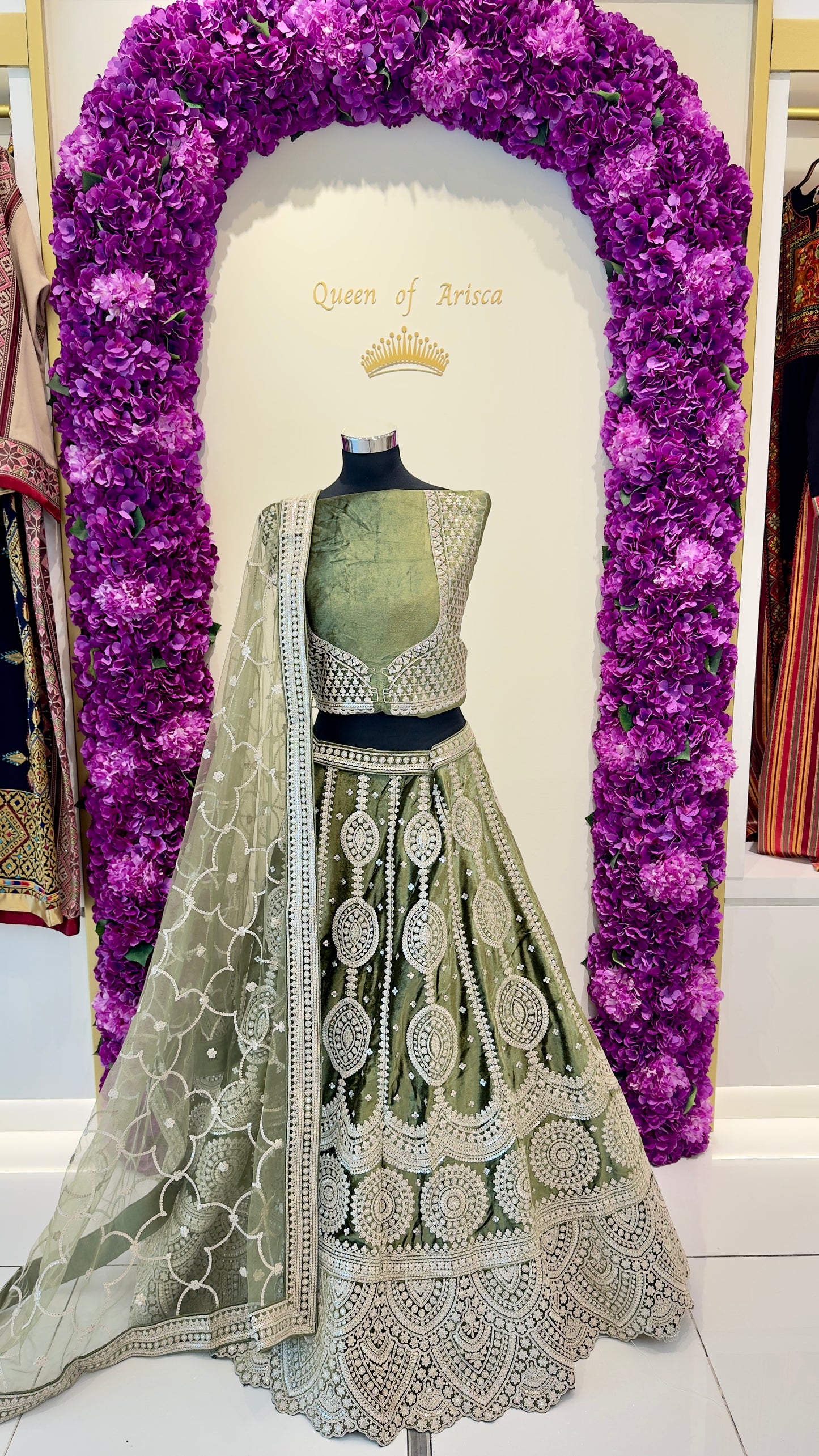 Luxury green embroidered lehenga in Qatar by Arisca