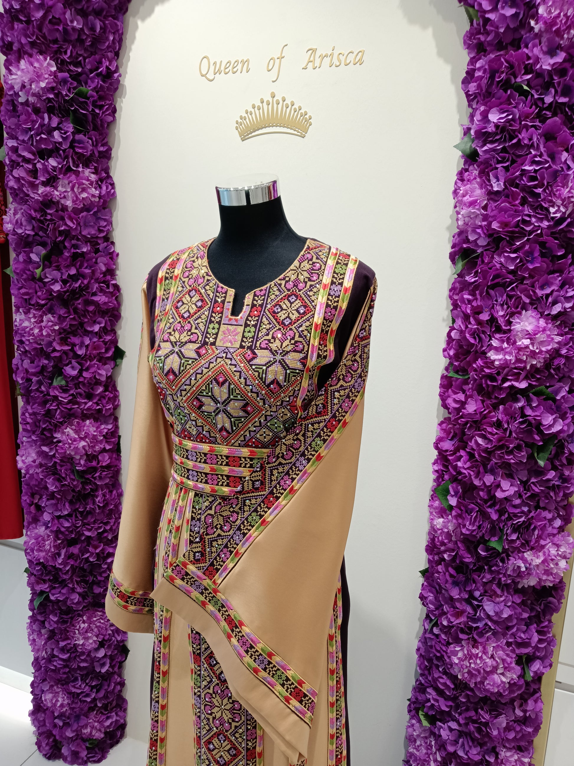 elegant Palestinian thobe in Qatar. Burgundy and champagne embroidered thobe
