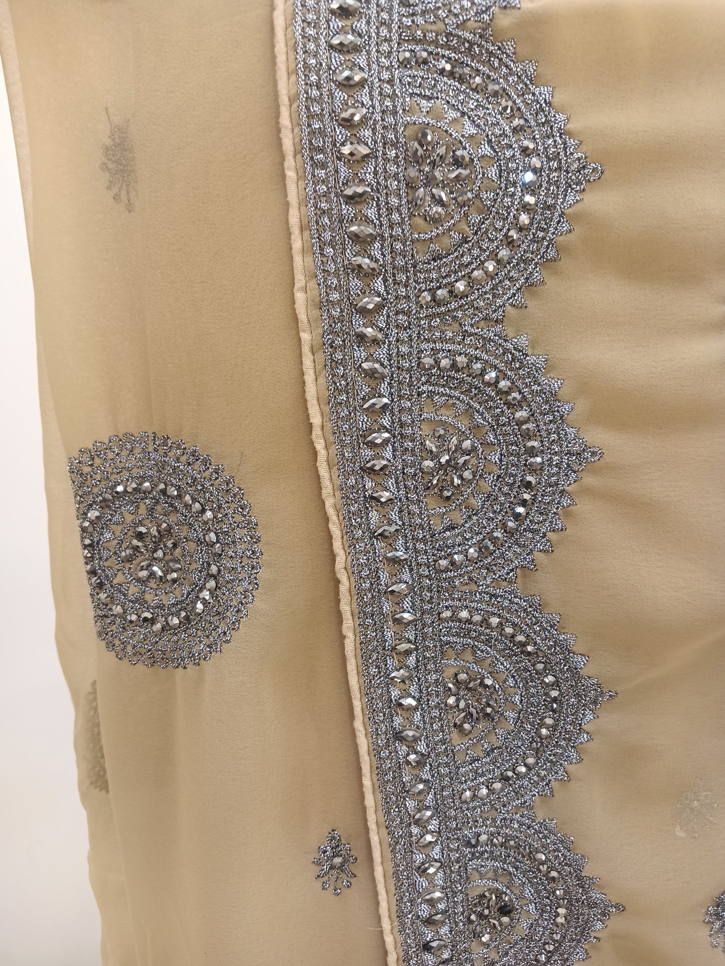heavy silver zari embroidery saree, intricate circular motifs, scalloped borders