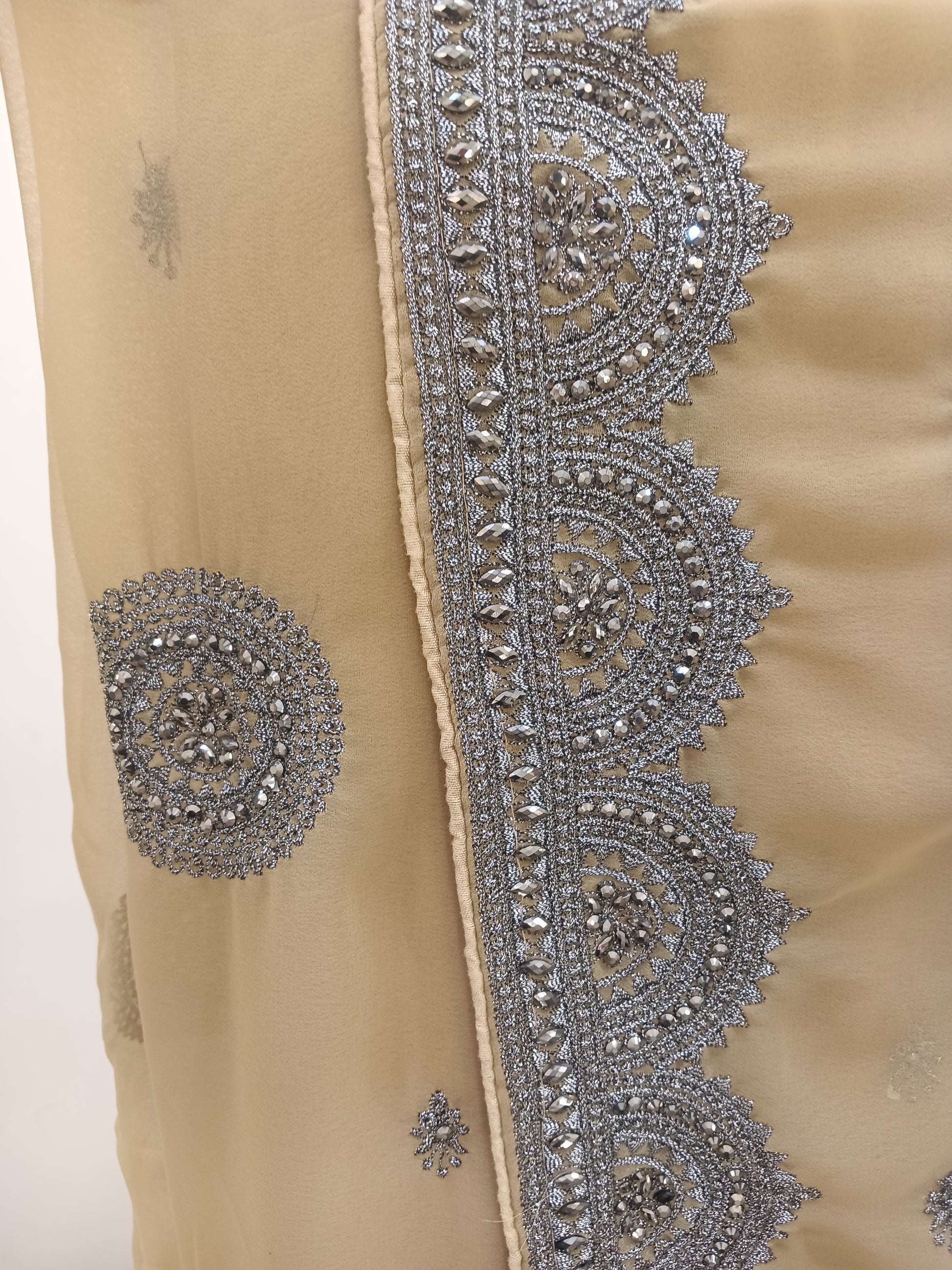 heavy silver zari embroidery saree, intricate circular motifs, scalloped borders