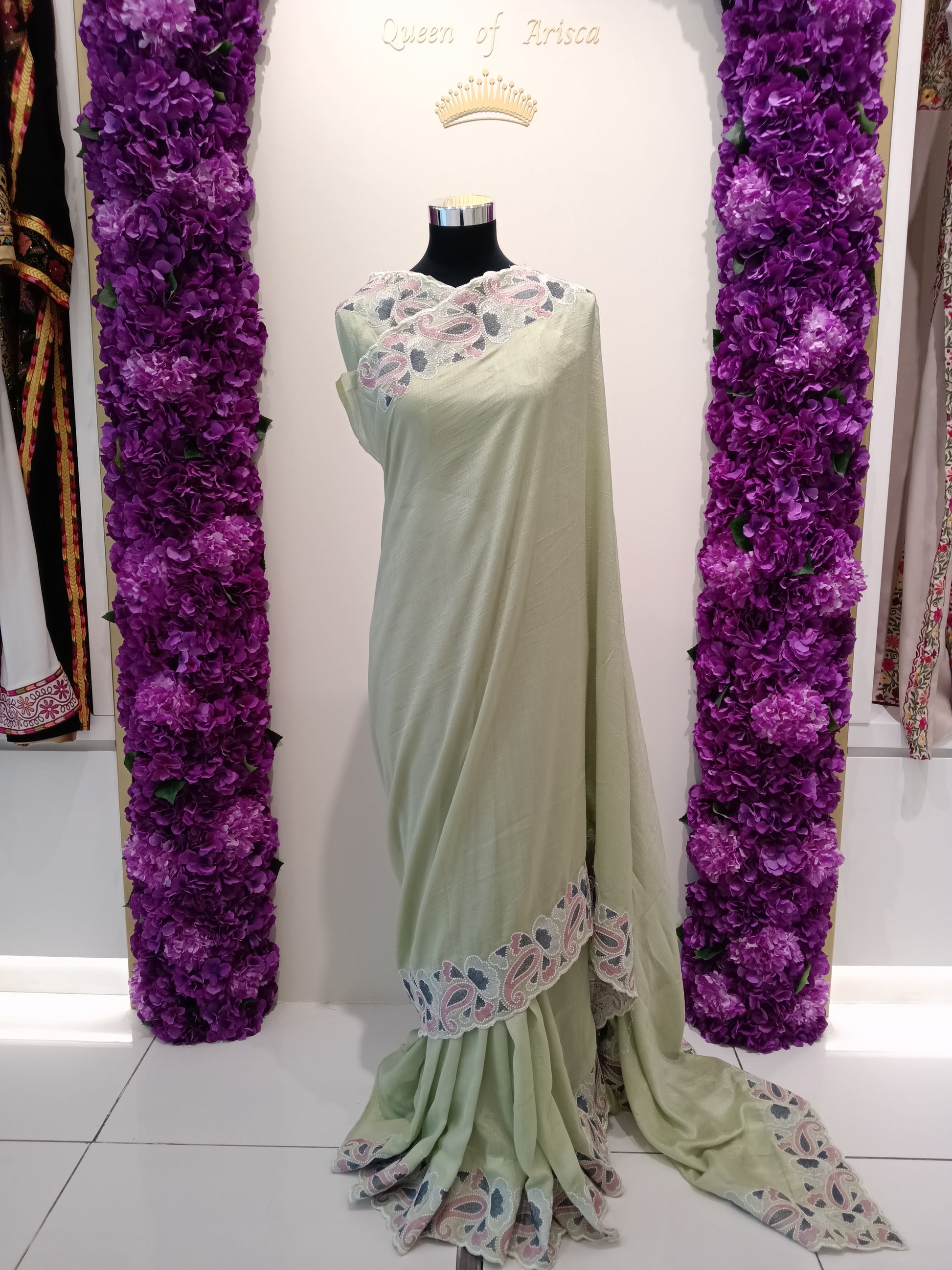 Shop mint pistachio green ready to wear saree in Qatar. Pre stitched with perfect pleats, soft flowy fabric and elegant embroidered border. Ideal for gatherings & Eid.