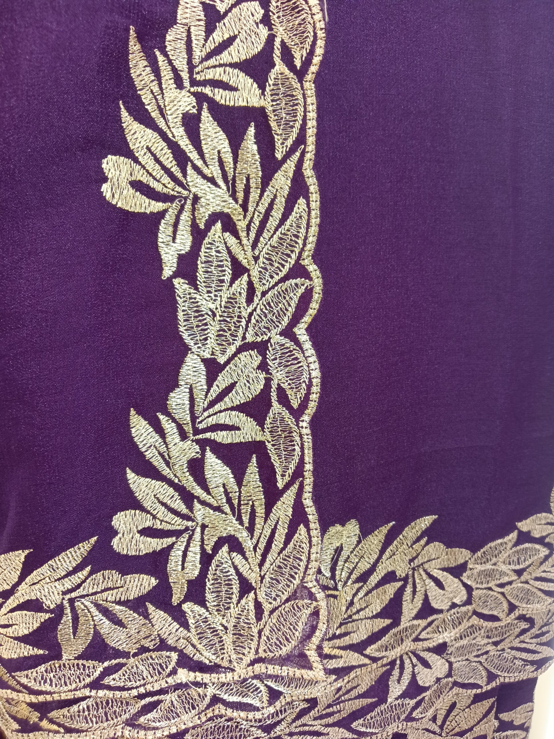 plum purple ready-to-wear saree, designed for modern women in Qatar. Made from a lightweight, flowy georgette-style fabric, it offers a graceful drape with all-day comfort.