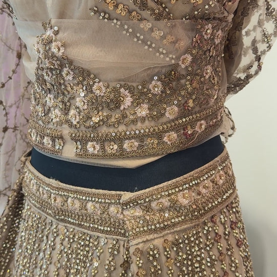details of golden Indian Lehenga