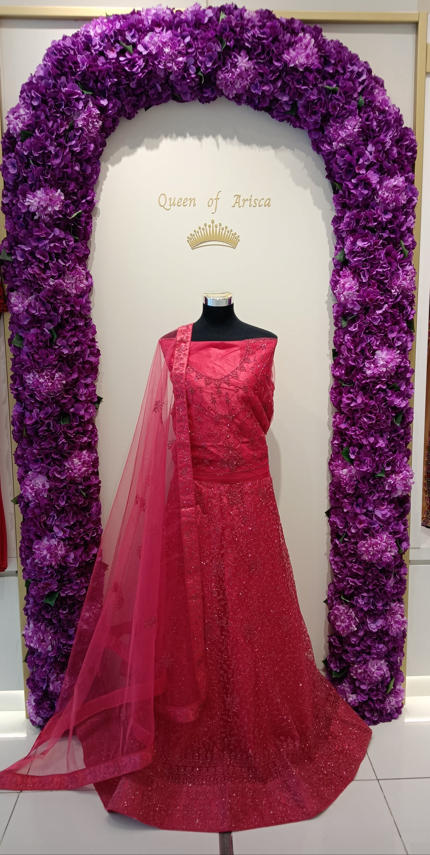 Stunning red pink lehenga crafted from luxurious net and shimmer embellished fabric, richly detailed with delicate sequins, beadwork, and intricate embroidery.