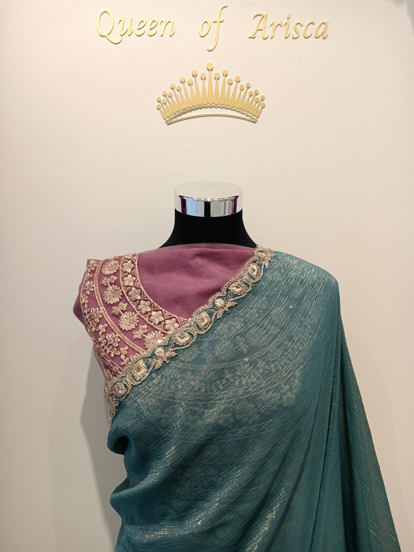 Shop elegant teal ready to wear saree in Qatar. Pre stitched with perfect pleats, soft shimmer fabric, finished with an elegant gold embroidered lace border, adding refined festive charm. Ideal for parties & events in Qatar.