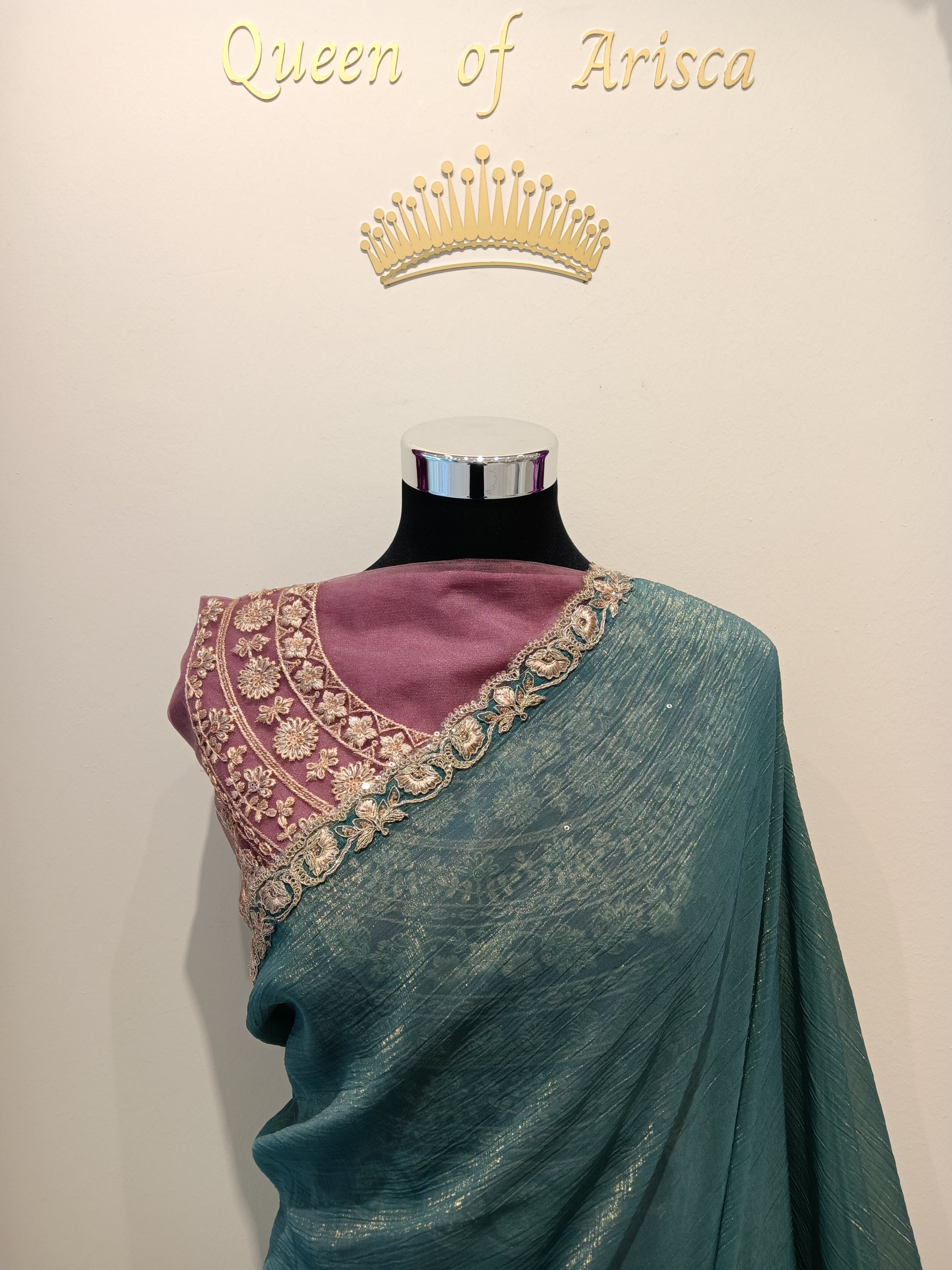 Shop elegant teal ready to wear saree in Qatar. Pre stitched with perfect pleats, soft shimmer fabric, finished with an elegant gold embroidered lace border, adding refined festive charm. Ideal for parties & events in Qatar.