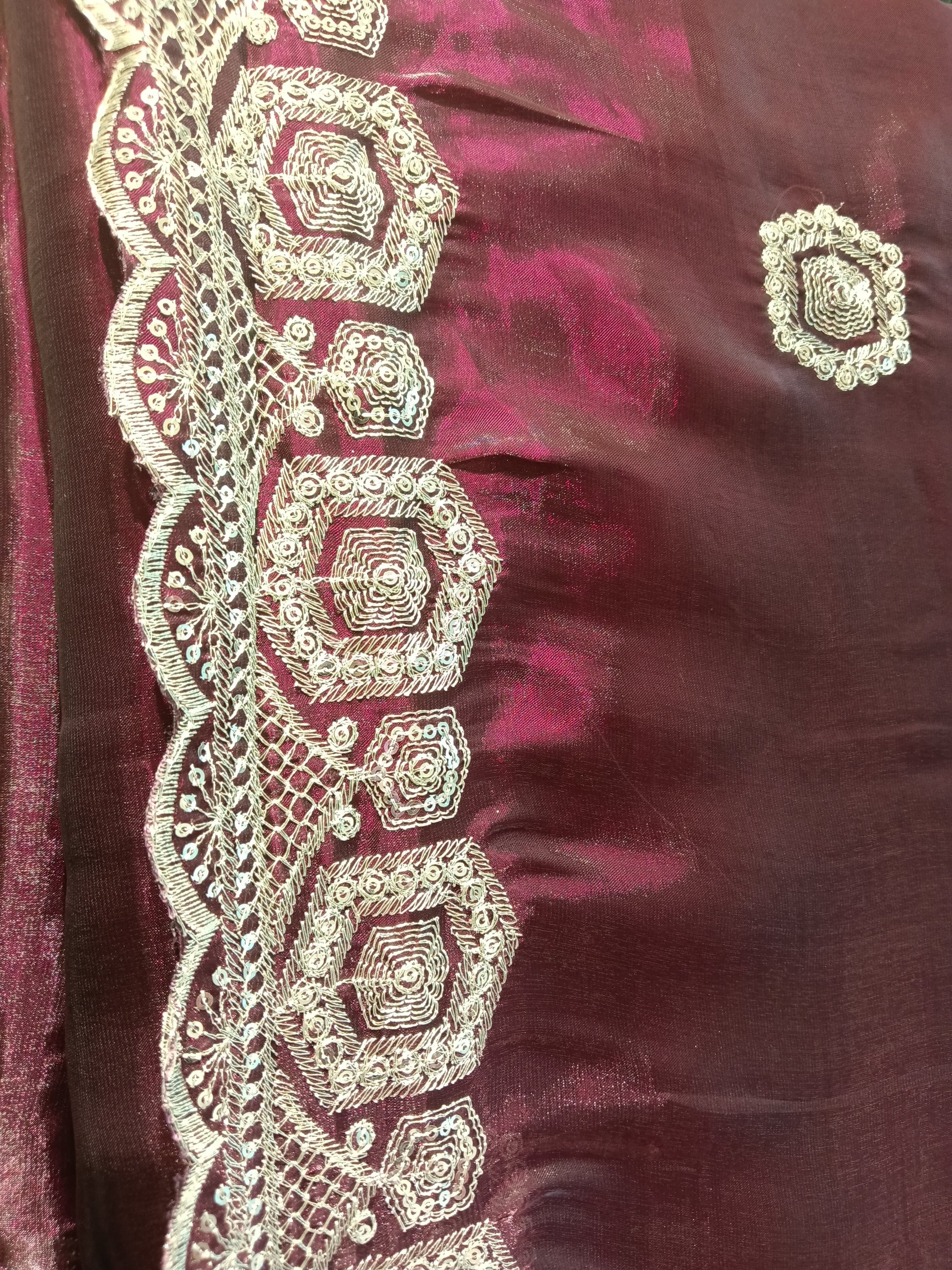 soft tissue silk fabric for a graceful drape and luxurious shimmer finish. Designed with intricate silver thread embroidery and elegant border detailing